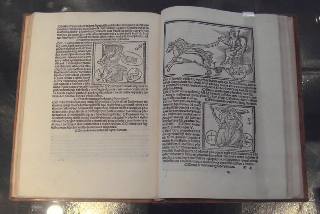 Photo: an open book of 1515 with woodcuts of Mars, marked with the male sign, and Venus, marked with the female sign